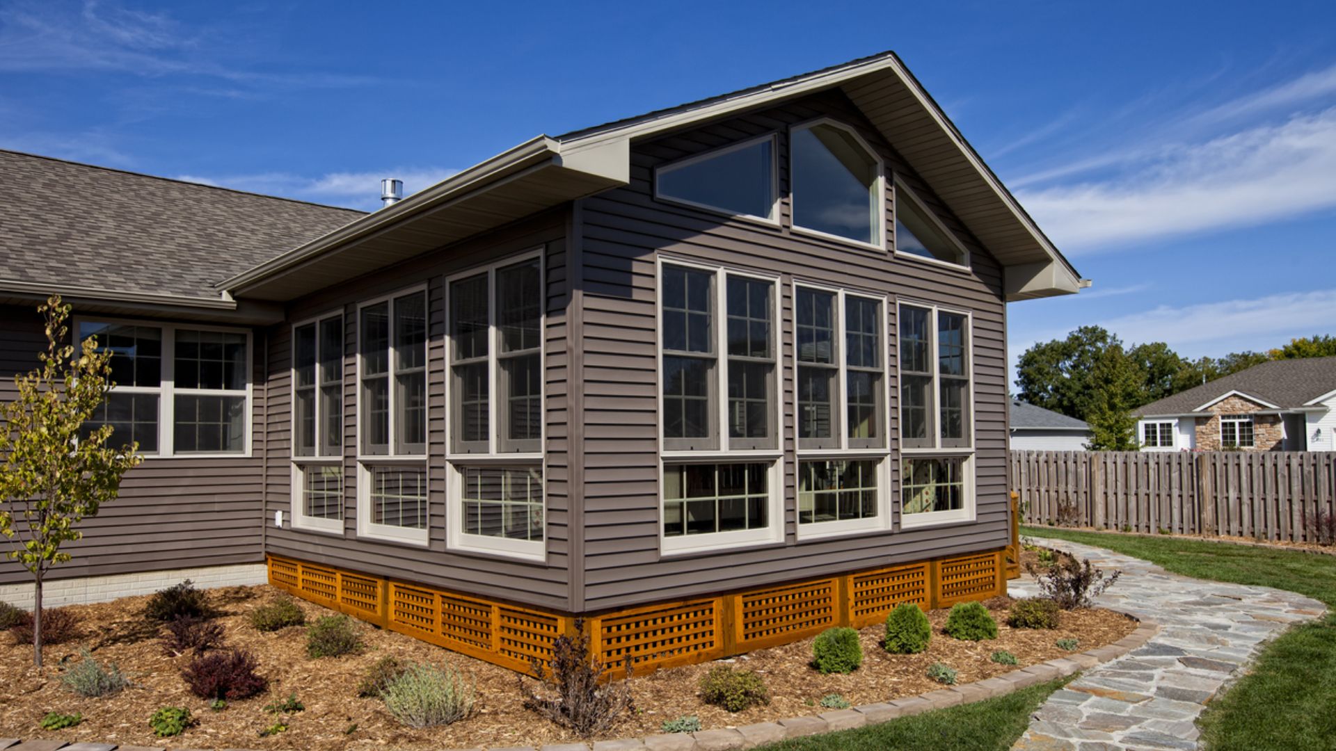 Sunroom addition with large windows in Kirkland home